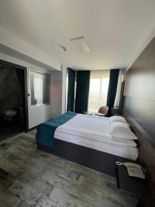 Voodi või voodid majutusasutuse Ladik Hotel toas