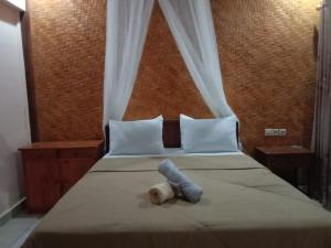 Postel nebo postele na pokoji v ubytování Ila Homestay