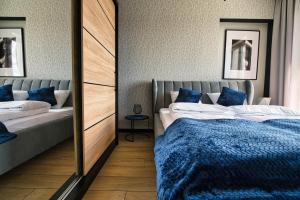 Posteľ alebo postele v izbe v ubytovaní Apartament Timi Zator by Housine