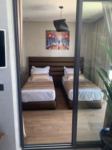 Giường trong phòng chung tại Hivernage +12 ảnh