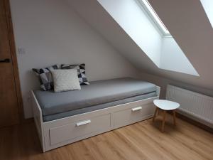 מיטה או מיטות בחדר ב-Rodinný dům Alois