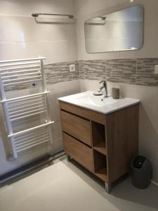 a bathroom with a sink and a mirror at fontaine in Aups +40 photos