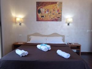 Posteľ alebo postele v izbe v ubytovaní Rome Travellers Hotel + 37 fotografií