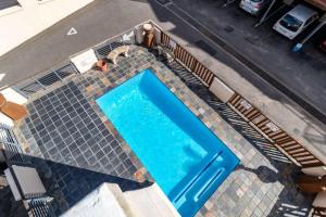 an overhead view of a swimming pool at Cozy All-in-One Ocean View Apartment in Kingsborough