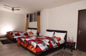 Postelja oz. postelje v sobi nastanitve Hotel Shanti Palace