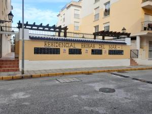 a sign on the side of a building at BRISAS DEL MAR II in Formentera del Segura