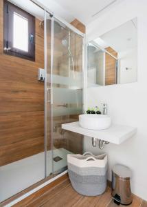 a bathroom with a sink and a shower at Limehome Barcelona Carrer de Fontcoberta - Digital Access in Barcelona