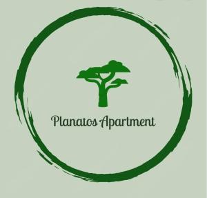 an illustration of a tree in a circle with the words planned apartment at Platanus Apartment in Vanáton