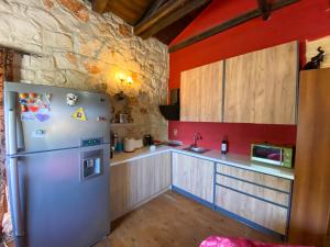 A kitchen or kitchenette at Platanus Inn Apartments by "elite"