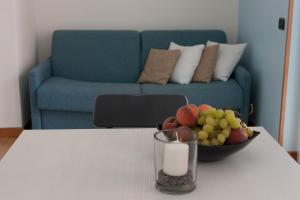 A seating area at Residence CaFelicita - Promotion - Apartments Lake View - Infinity Pool - Jacuzzi