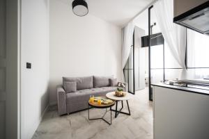 a living room with a couch and a table at Old Town Design Apartments in Sarajevo