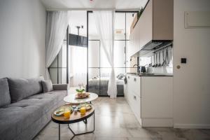a living room with a couch and a table at Old Town Design Apartments in Sarajevo