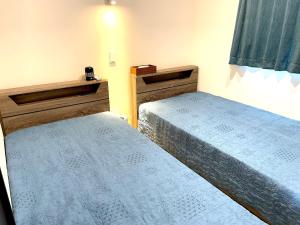 Postel nebo postele na pokoji v ubytování UMITOHOSI