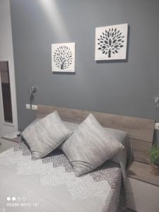 Postel nebo postele na pokoji v ubytování Hostal Puerta Carmona