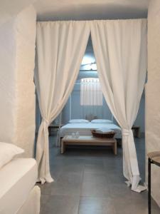 A bed or beds in a room at Casa Vacanza "La Mangiatoia in corte"