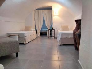 A bed or beds in a room at Casa Vacanza "La Mangiatoia in corte"