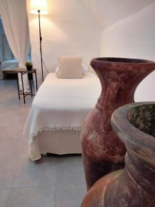 A bed or beds in a room at Casa Vacanza "La Mangiatoia in corte"
