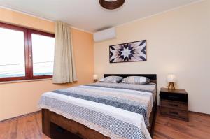 Ένα ή περισσότερα κρεβάτια σε δωμάτιο στο Apartment Slavko