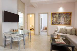 a living room with a couch and a table at Mystique Apartment in Karpathos Town