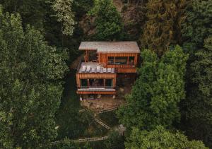 an aerial view of a house in the trees at Hotel Bad Fallenbach in San Leonardo in Passiria