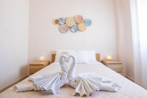 Postel nebo postele na pokoji v ubytování Mystique Apartment