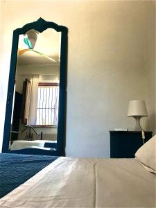 A bed or beds in a room at B&B La Roverella