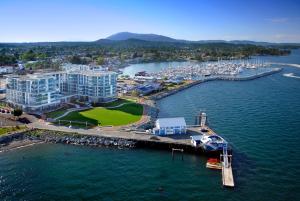 an aerial view of a marina with boats in the water at The Sidney Pier Hotel & Spa in Sidney