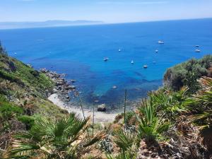 a view of a beach with boats in the water at Gli Appartamenti degli Dei in Milazzo