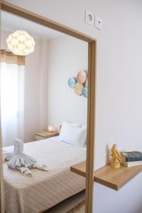 Postel nebo postele na pokoji v ubytování Mystique Apartment