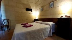 Postel nebo postele na pokoji v ubytování B&B La Nicchiarica