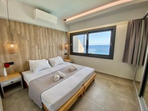 Giường trong phòng chung tại Ostria Apartments