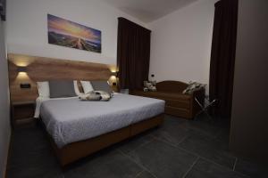 Postel nebo postele na pokoji v ubytování Hotel Crisvan