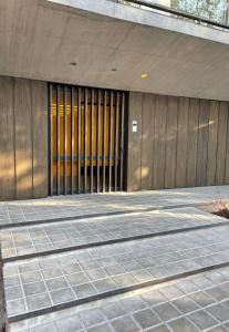 a front door of a building with a sidewalk at ROCAS DEL PLATA (Mendoza Capital) in Mendoza