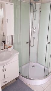a bathroom with a shower and a sink at Apartments Katarina in Sutivan