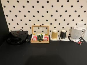 a table with a mirror and other items on it at Jz Plus Picasso in Rhodes Town