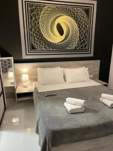 Ένα ή περισσότερα κρεβάτια σε δωμάτιο στο Jz Plus Picasso