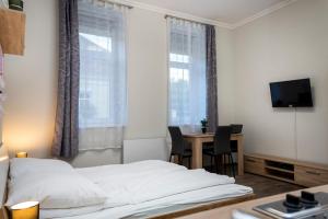 Postel nebo postele na pokoji v ubytování Kolibri Apartman - Makó