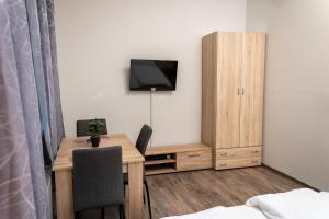 TV a/nebo společenská místnost v ubytování Kolibri Apartman - Makó