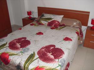 a bed that has some pillows on it at Pension El Guanche in Frontera