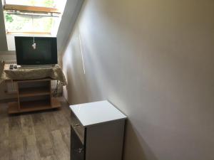 A television and/or entertainment centre at Family Wellness Apartman