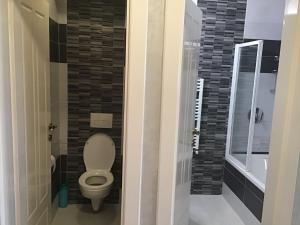 A bathroom at Family Wellness Apartman