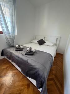 Postel nebo postele na pokoji v ubytování Apartments Antolkovic