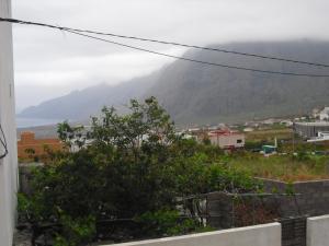 a view from a balcony overlooking a mountain range at Pension El Guanche in Frontera