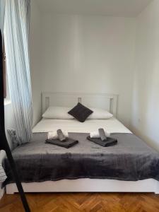 Postel nebo postele na pokoji v ubytování Apartments Antolkovic