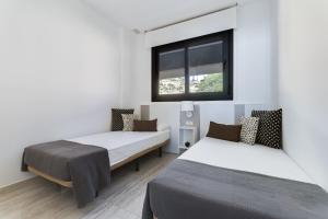 Posteľ alebo postele v izbe v ubytovaní OCEAN DRIVE by Costa Activa Rentals
