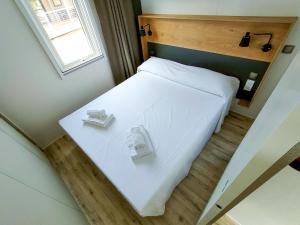 A bed or beds in a room at Garda Di Vino Agricamping & Wine Shop Lazise
