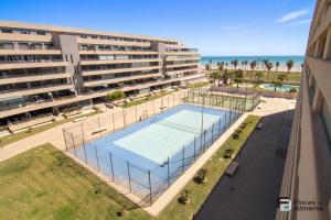 an overhead view of a tennis court in front of a building at Apartamento Residencial Mirador Playa Serena in Roquetas de Mar