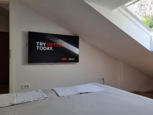 Postel nebo postele na pokoji v ubytování Geek Apartment