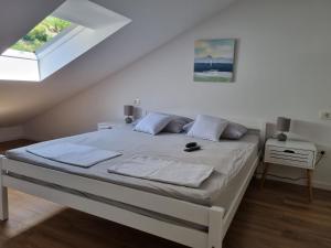 Postel nebo postele na pokoji v ubytování Geek Apartment