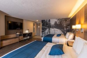Postel nebo postele na pokoji v ubytování Auberge L'Étape + 21 fotografií